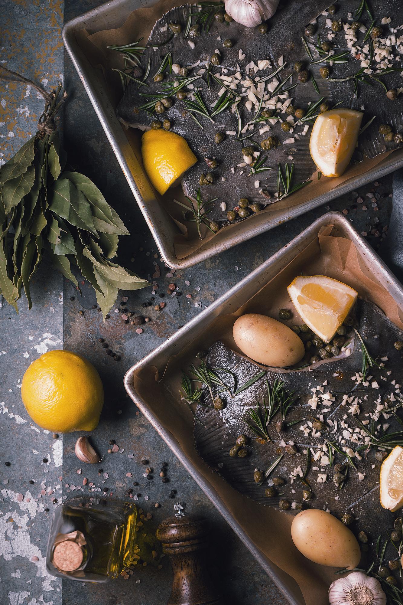 Worktable with herbs, copper pans and a notebook